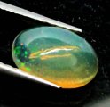 (bild för) Bra Pris Topp Lyster Etiopisk Opal 0,57 carat Oval Cabochon Slipning Topp Kvalitet Köp Nu!