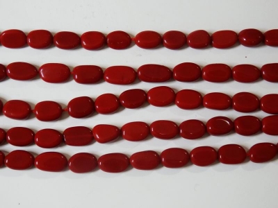 Sträng Röd Sandsten ca 70 carat Polerad Oval Borrad Fin Kvalitet och Lyster