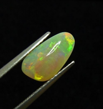 Bra Pris Lystrande Solid Opal 0,97 carat Fancy Cabochon från Australien Köp Nu!