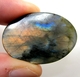 Bra Pris Mycket Fin Kvalitet Regnbågs Lystrande Labradorit 55,82 carat Oval Cabochon Slipning Suverän Lyster & Färgspel från Madagaskar köp Nu!